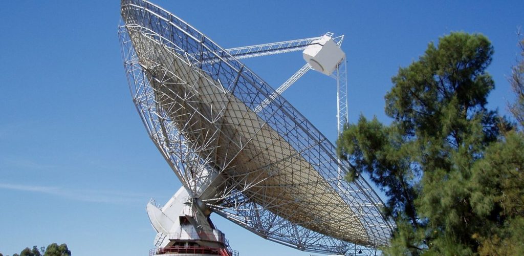 Large radio telescope dishes against the sky