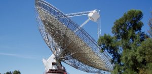 Large radio telescope dishes against the sky